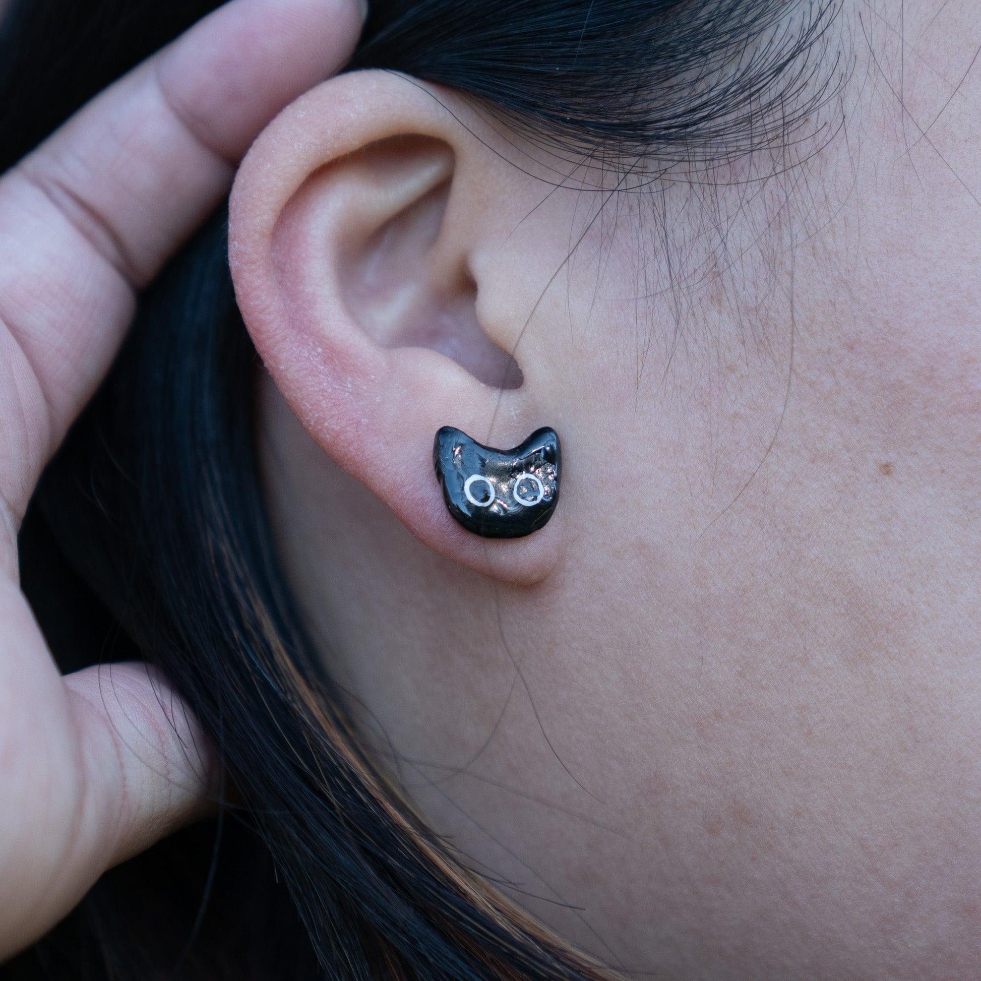 black cat polymer earrings with big eyes, uv resin coated.