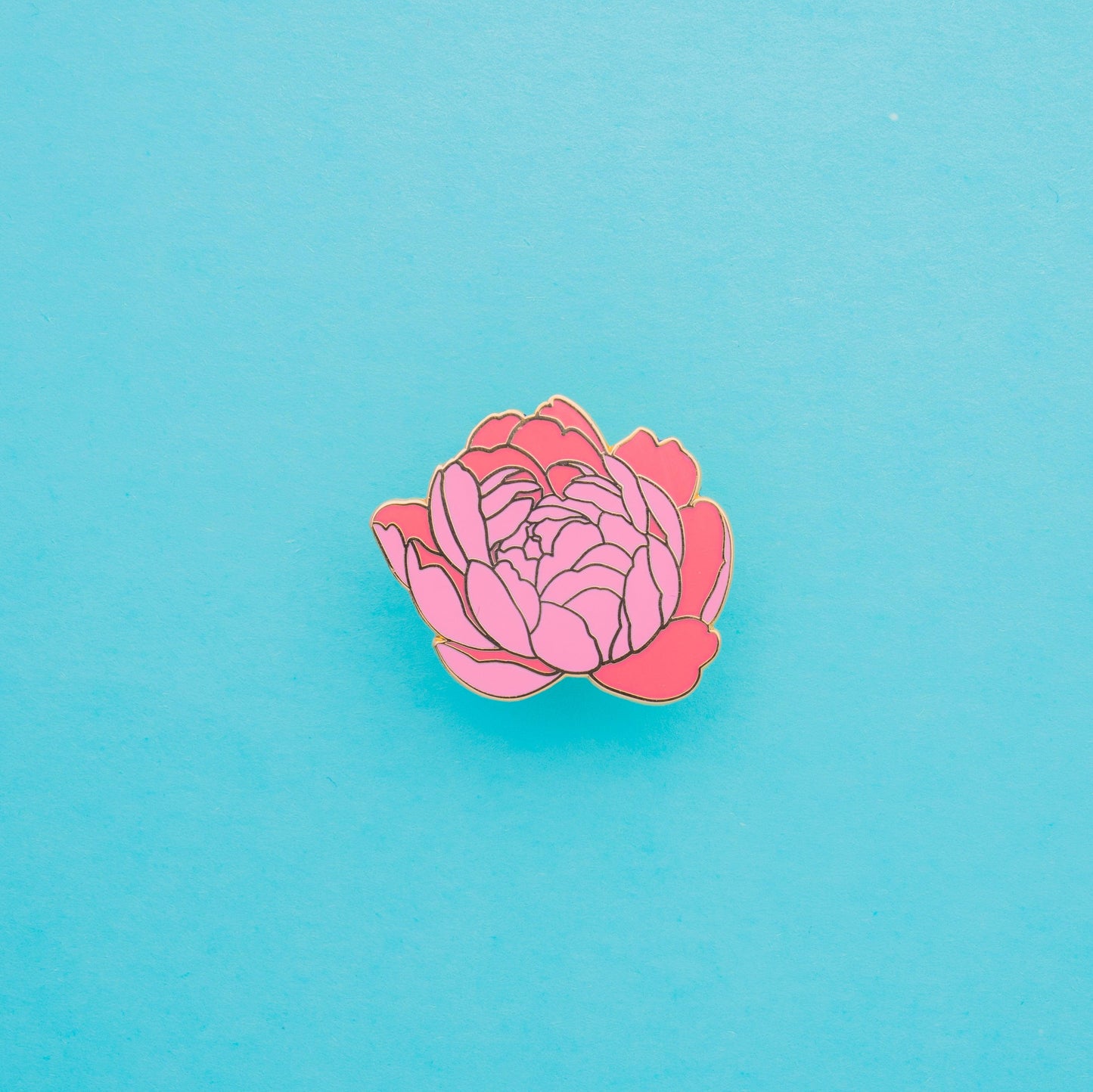 coral coloured beautifully gold detailed peony hard enamel pin