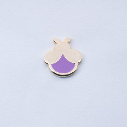 gold plated mini firefly enamel pin with lavender body that glows in the dark