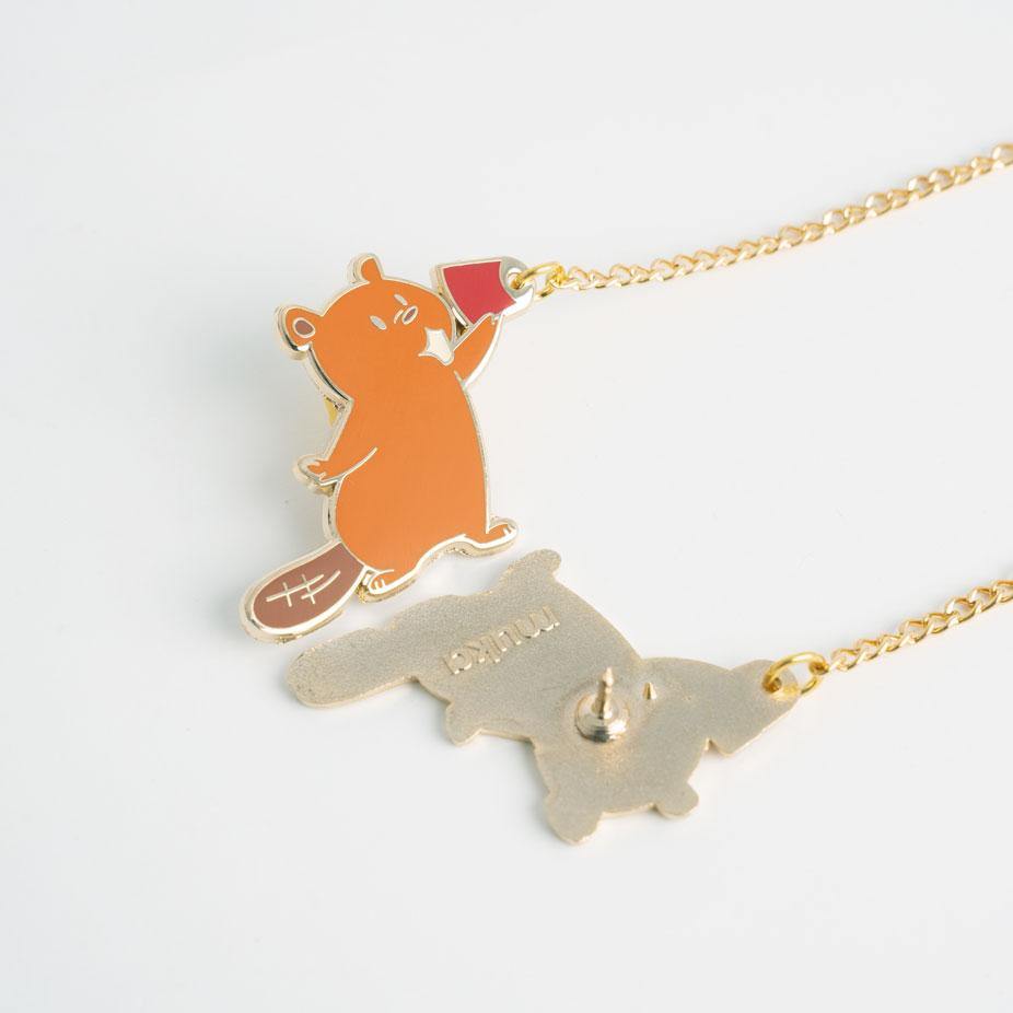 cute beaver holding red cup to ear pin with chain attached to second cute beaver